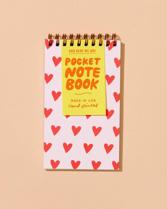 pocket sized notebook with illustrated hearts on the front cover. lined inside pages