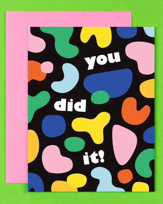 black greeting card with colorful shapes on it and text that reads: you did it!