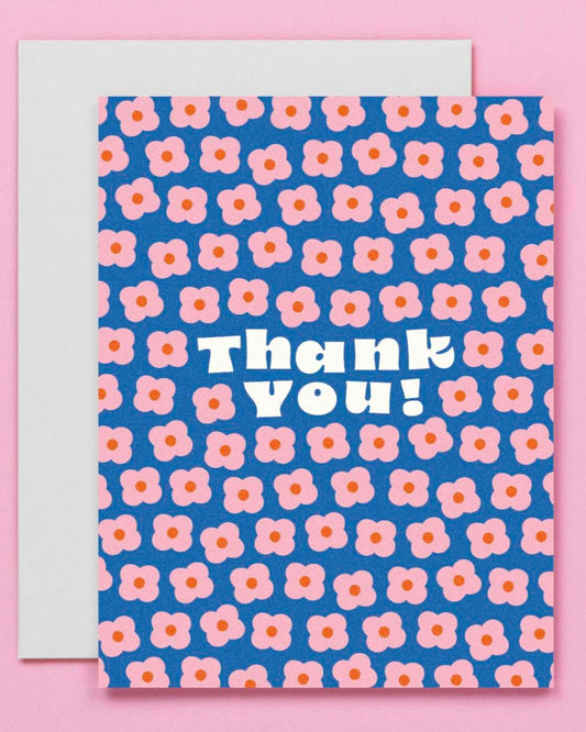 blue thank you card with illustrated pink flowers on it