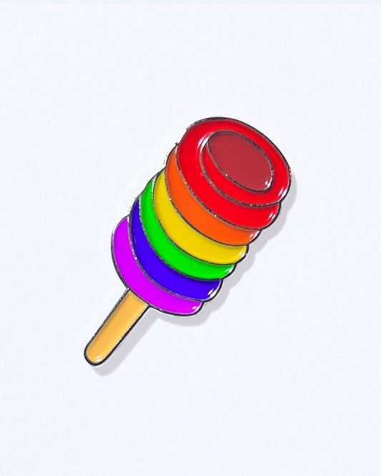 A colorful popsicle pin with a silver enamel finish and a red and white butterfly clasp.