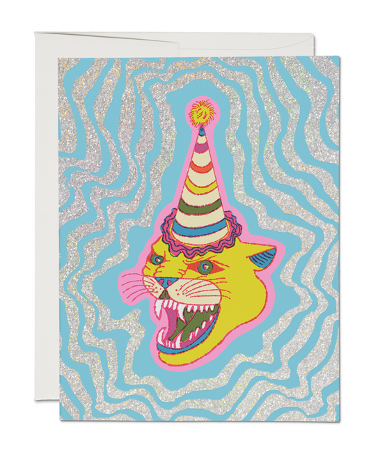 Greeting card with a colorful lion wearing a party hat on a blue and white wavy patterned background