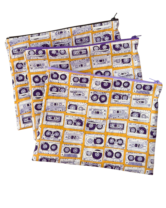 Two pouches with cassette tape pattern on a white background