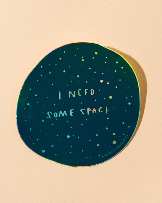 holographic vinyl sticker of space that says I need some space