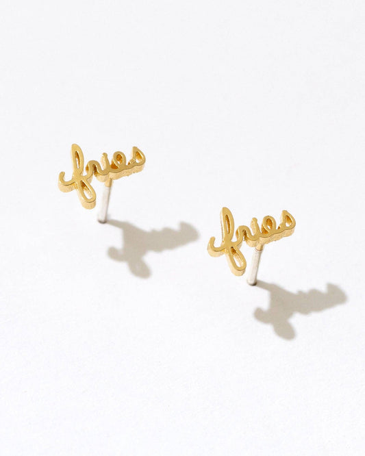 A pair of gold-plated stud earrings that say fries.