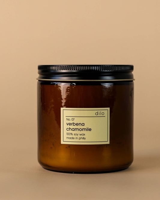 verbena & chamomile scented soy wax candle in a glass jar