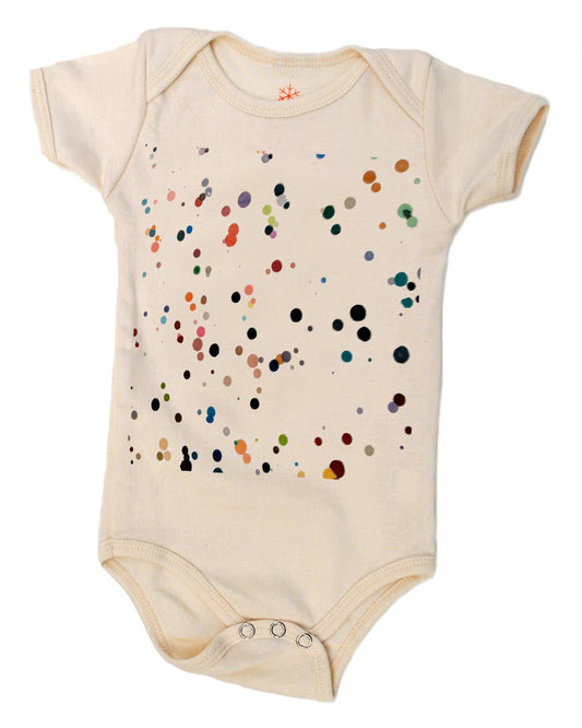 Beige baby onesie with colorful dot pattern on a white background