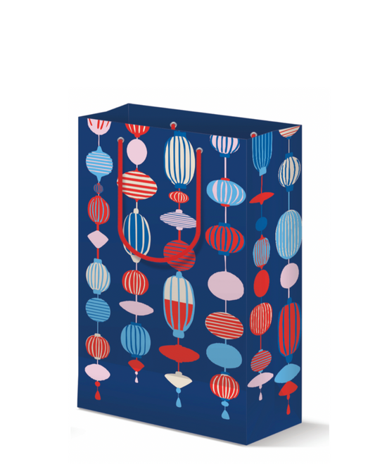 Blue holiday gift bag with colorful lantern pattern and red cotton handles