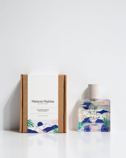 Perfume bottle and packaging with 'Maison Matine' branding on a white background