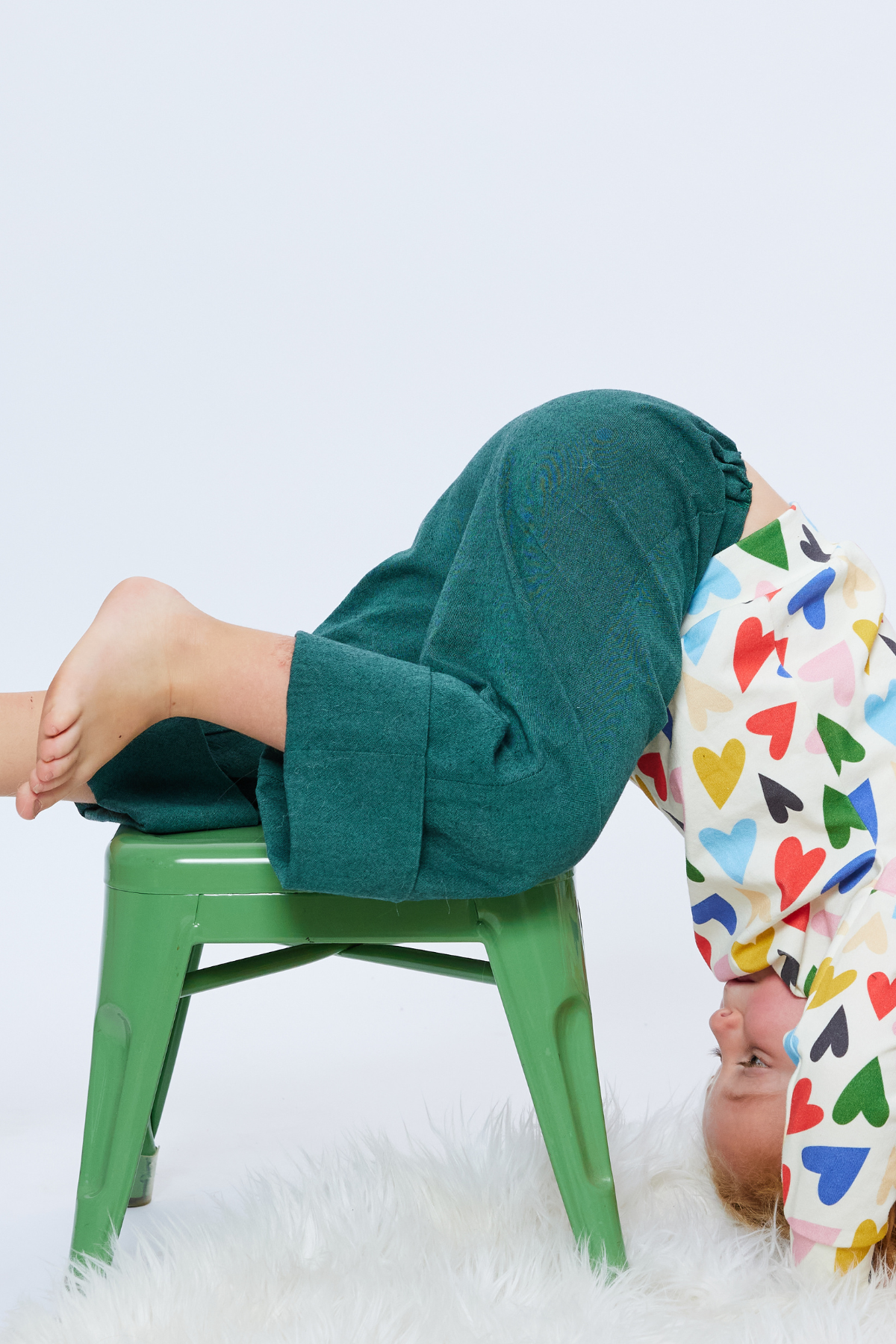 toddler playing wearing colorful sustainable green pants