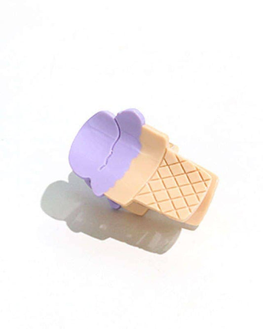 A mini ice cream hair claw with a purple and beige color scheme designed in San Francisco, California. The design resembles an ice cream cone with a waffle pattern on the ice cream part.