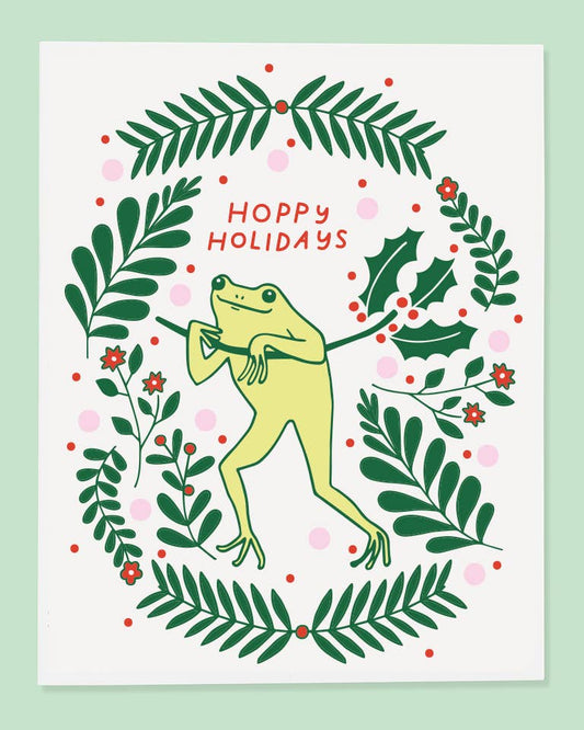 holiday card featuring an illustrated frog that says: hoppy holidays