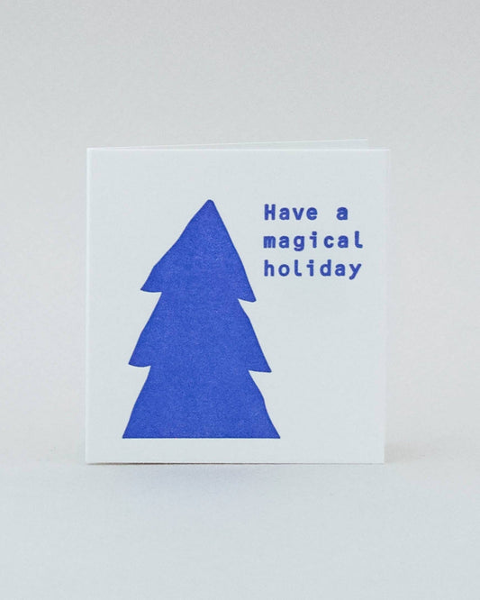 Mini holiday card that says: Have a magical holiday in blue.