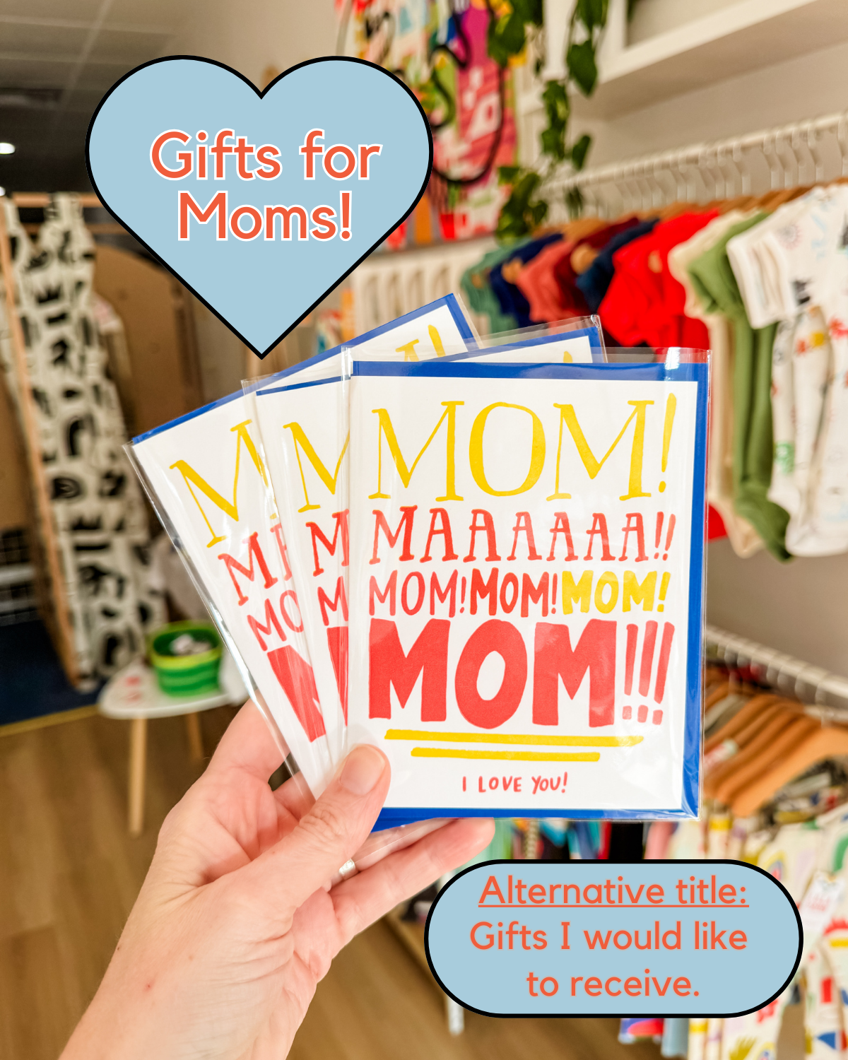 Mother's Day cards being held by a hand