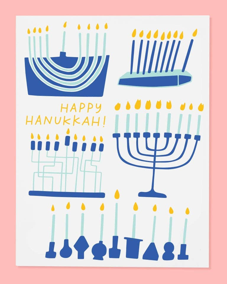 Happy Hanukkah card with blue menorahs and candles on a pink background