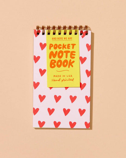 pocket sized notebook with illustrated hearts on the front cover. lined inside pages