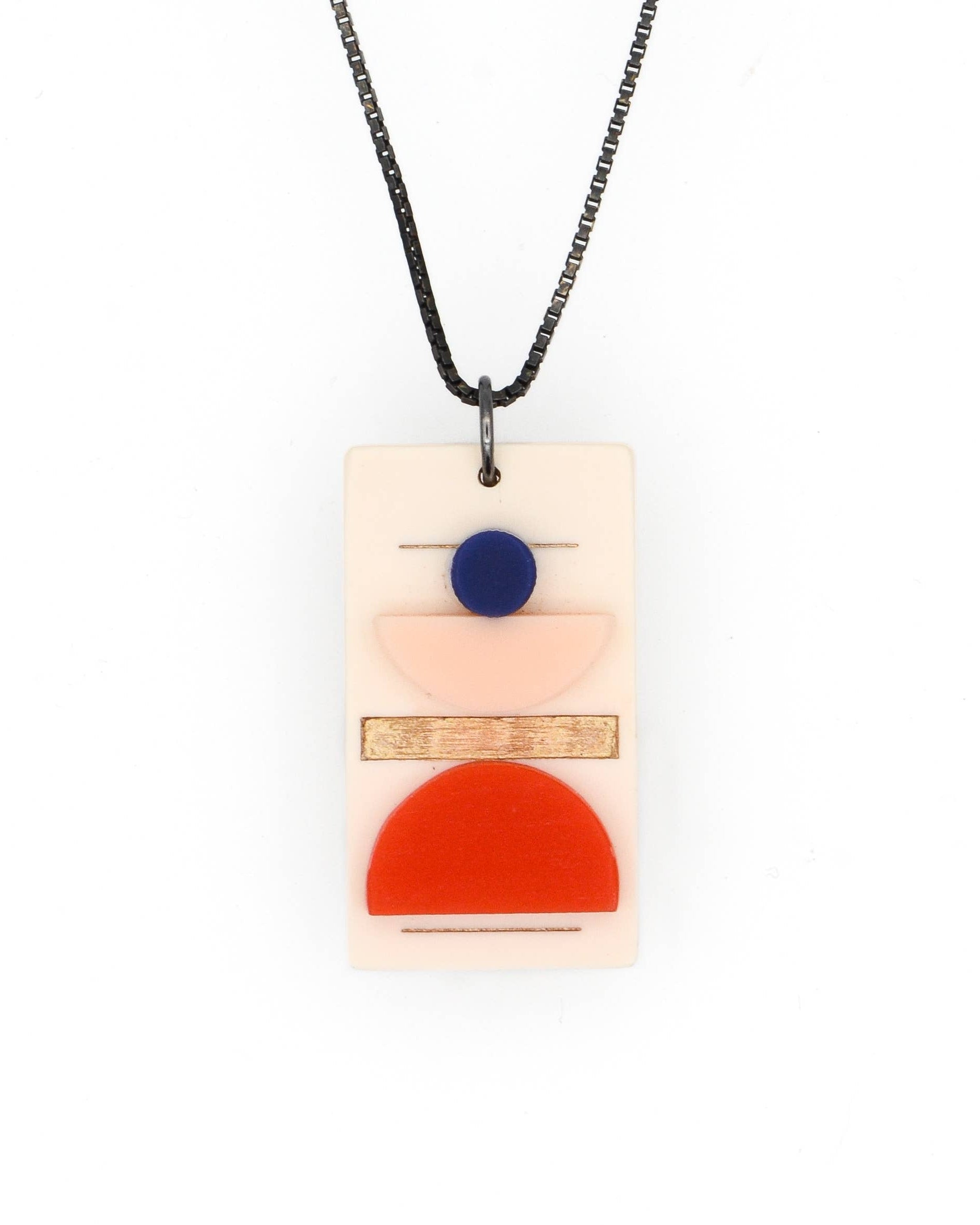 Necklace with a rectangular pendant featuring geometric shapes on a white background