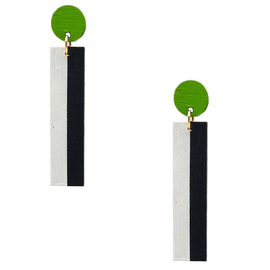 A pair of geometric dangle earrings featuring a vibrant green circular top, a small gold ring connector, and a vertical rectangular drop split into two textured panels, one white and one black.