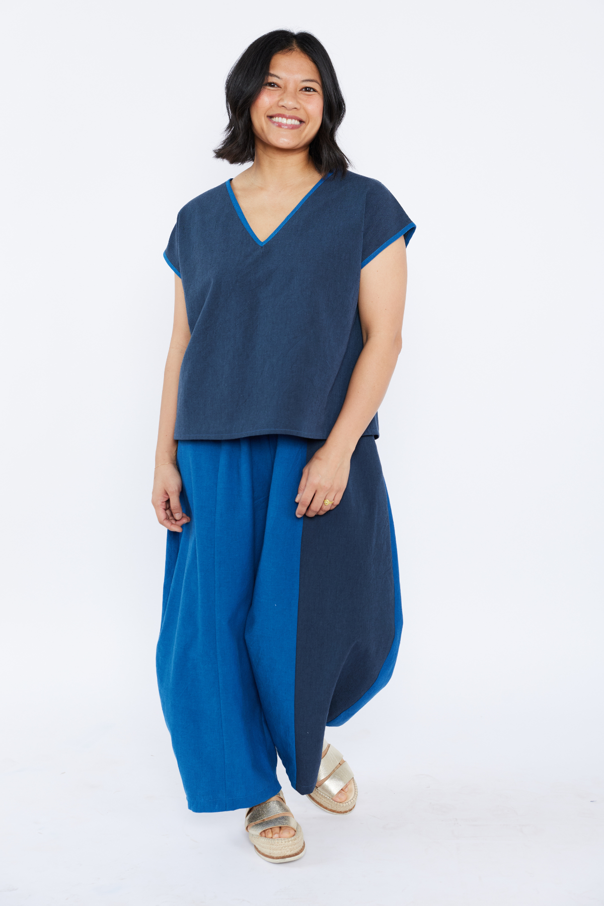 Woman wearing a blue outfit on a white background