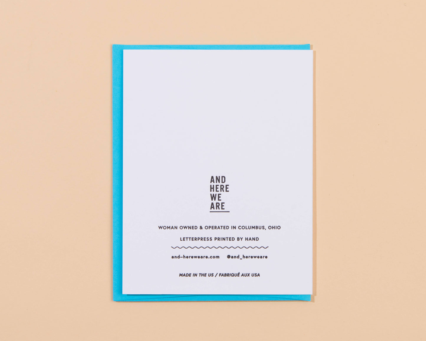 White card with black text on a beige background