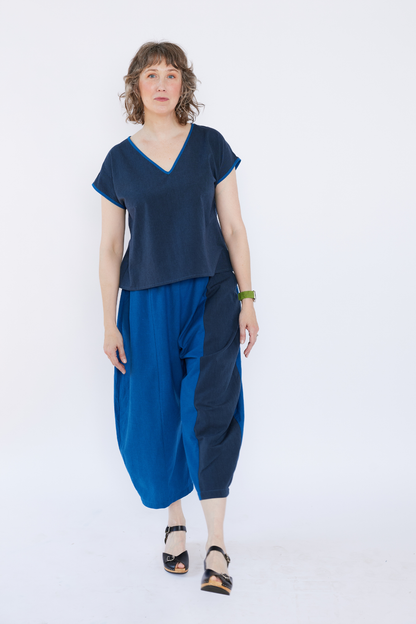 Woman wearing a blue outfit with a white background