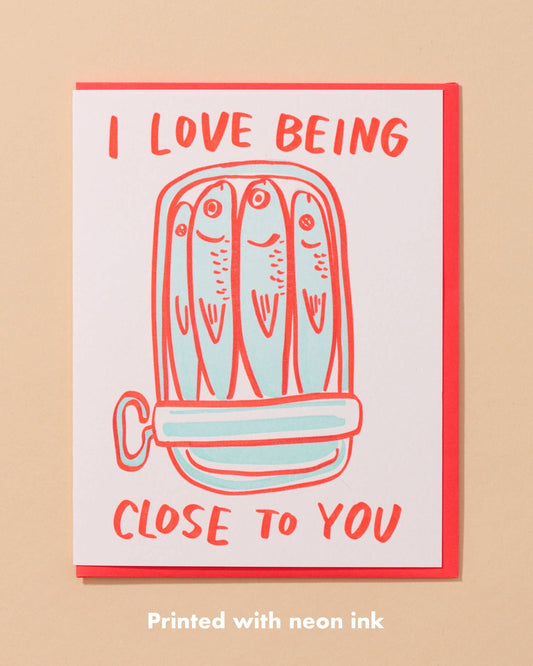 love card with a can of sardines