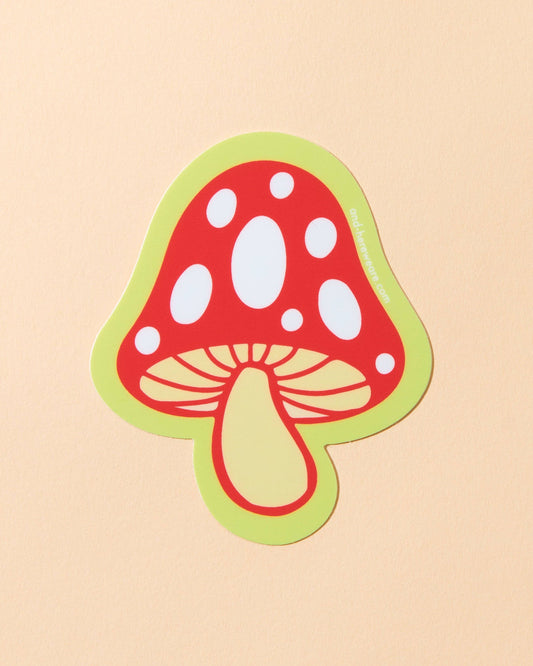 Sticker of a red mushroom with a green border on a beige background