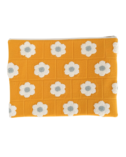 yellow laptop pouch with white floral patterns on a white background