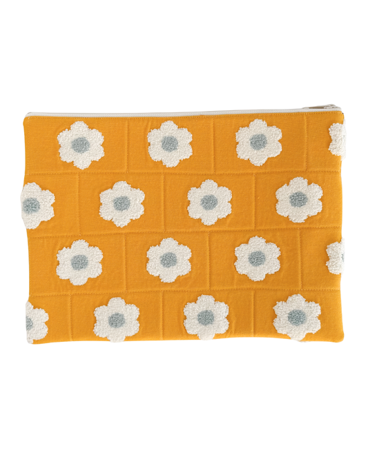 yellow laptop pouch with white floral patterns on a white background