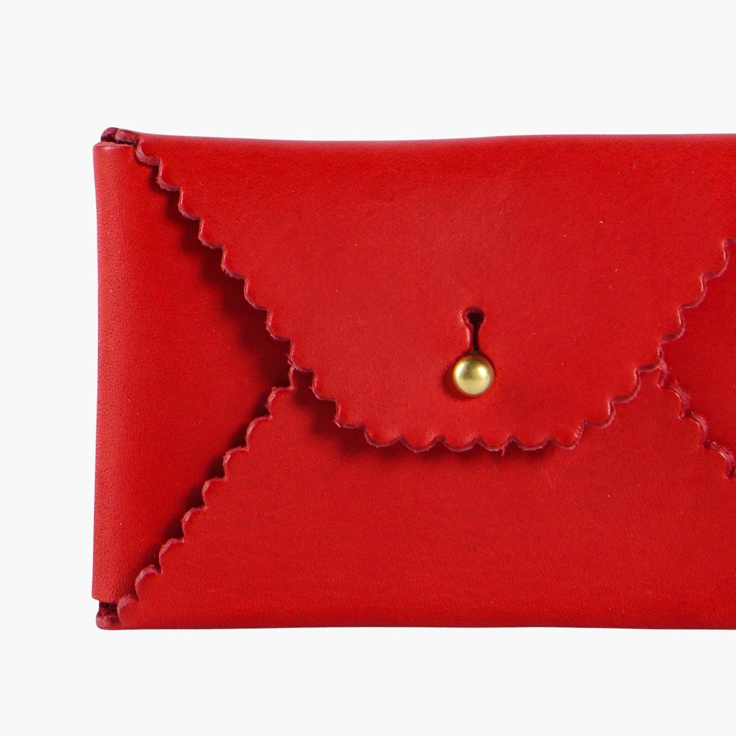 Red leather wallet with a gold clasp on a white background