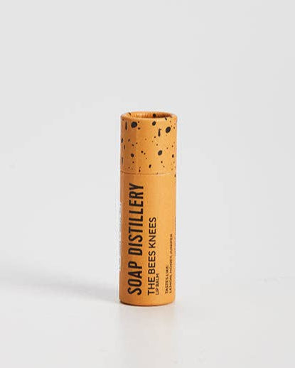 Moisturizing lip balm with honey scent in compostable packaging. 