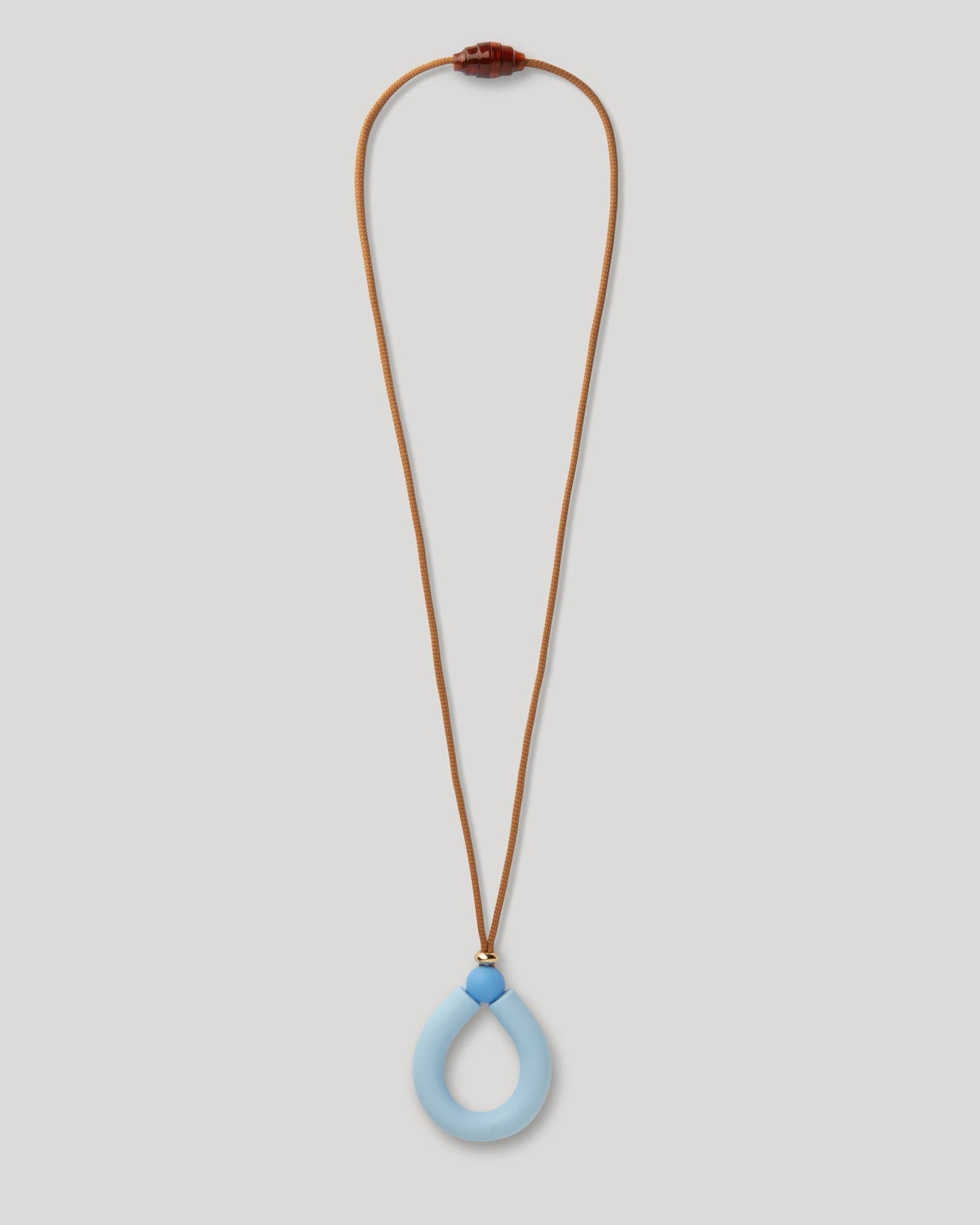 teething Necklace with a blue pendant on a light gray background