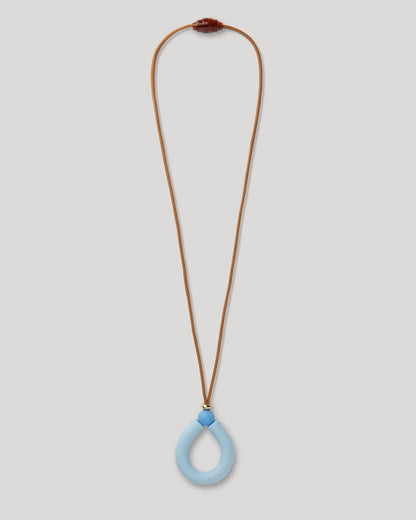 teething Necklace with a blue pendant on a light gray background