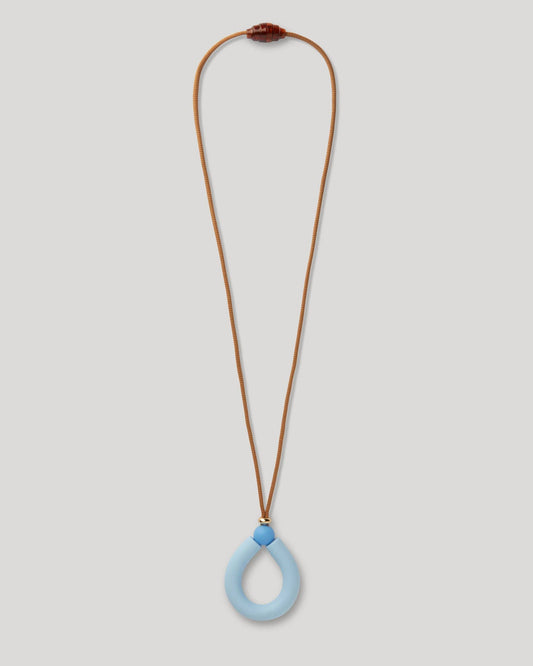 teething Necklace with a blue pendant on a light gray background
