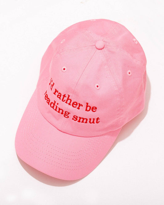 pink cotton baseball hat that says: I'd rather be reading smut