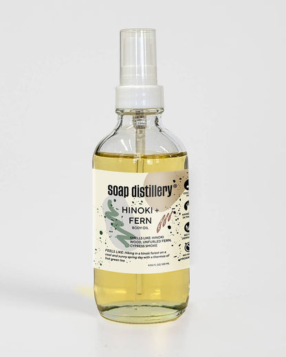 Bottle of Soap Distillery Hinoki Fern body oil on a white background