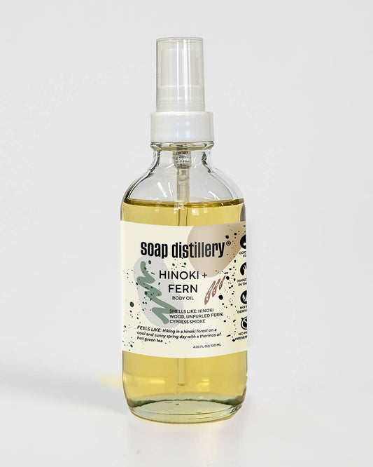 Bottle of Soap Distillery Hinoki Fern body oil on a white background