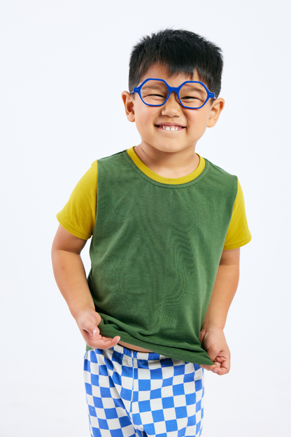 Child wearing sustainable green and yellow t-shirt, organic blue & white leggings,  and blue glasses from Eye Spy Optical