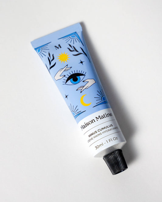 Tube of hand cream with scent of pear, sandalwood, and vanille