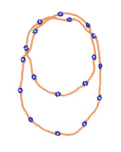 A beaded necklace made of small orange beads with repeated blue flower-shaped beads spaced along the strand, shown on a plain white background.