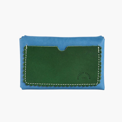 Blue and green Italian leather wallet with a visible brand logo on a white background