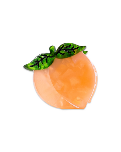 Peach-shaped mini hair clip with green leaves on a white background