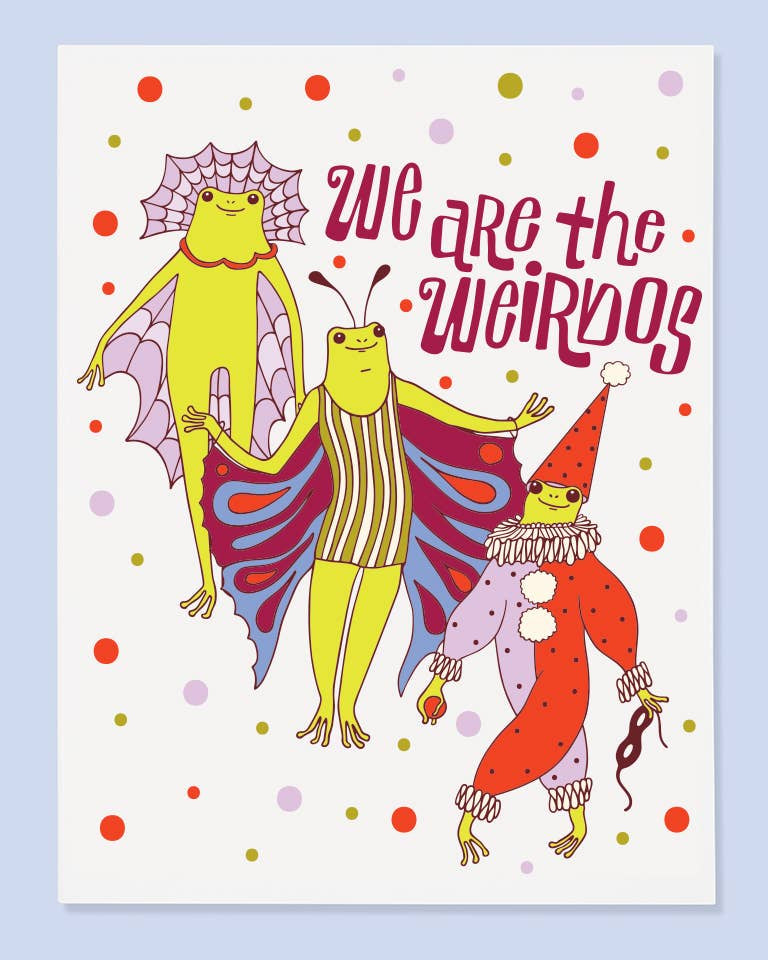 A whimsical greeting card featuring three cartoon frogs in costumes with the text 'we are the weirdos' on a white background, surrounded by colorful polka dots and set against a light blue backdrop.
