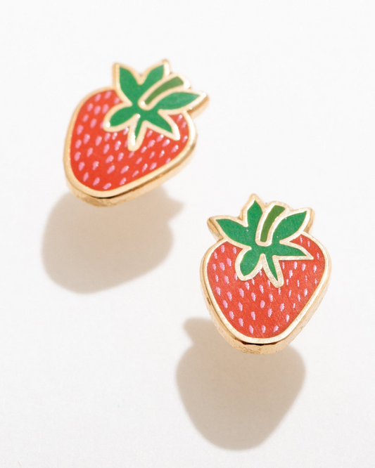 Strawberry-shaped earrings with gold rims on a white background