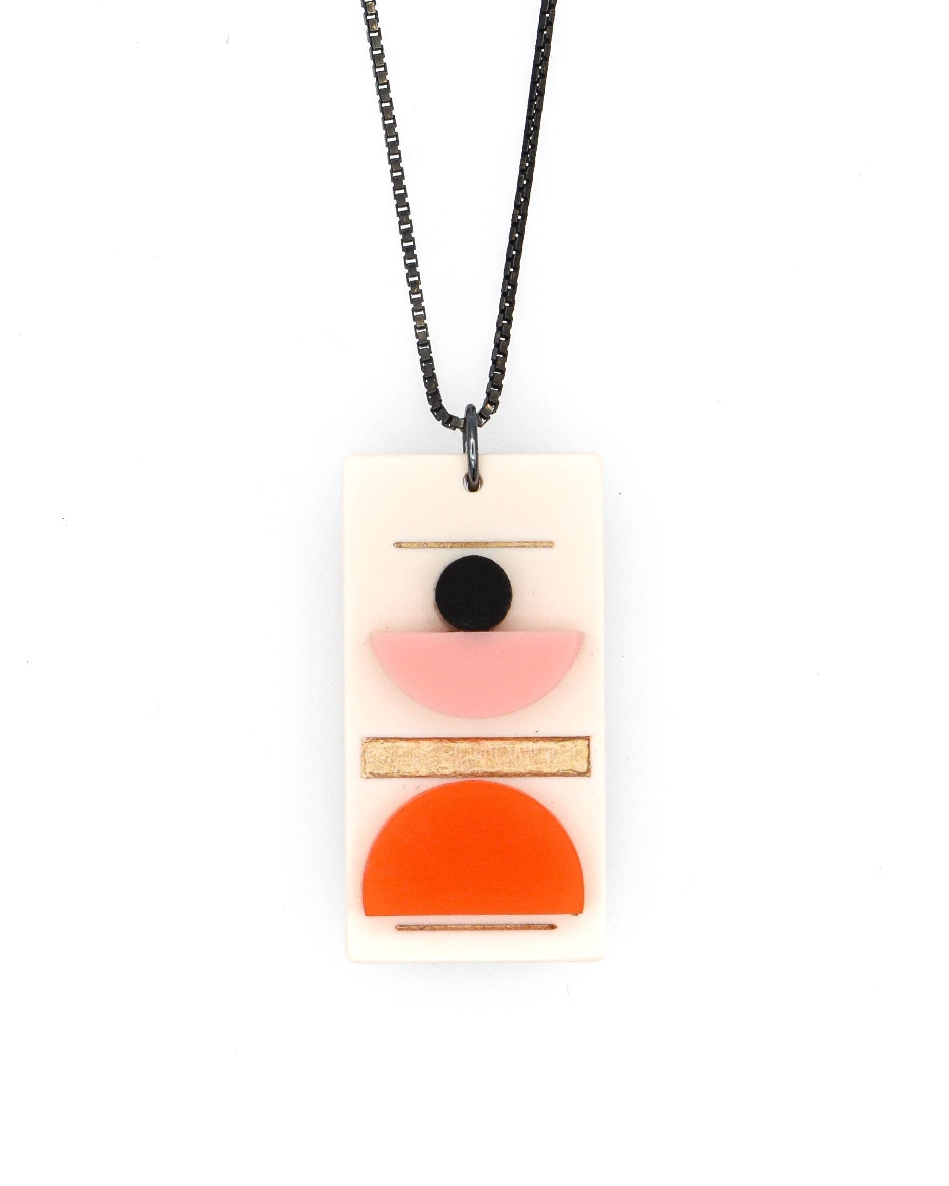 Necklace with a rectangular pendant featuring geometric shapes on a white background