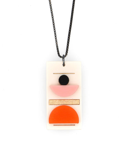 Necklace with a rectangular pendant featuring geometric shapes on a white background