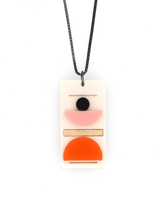 Necklace with a rectangular pendant featuring geometric shapes on a white background