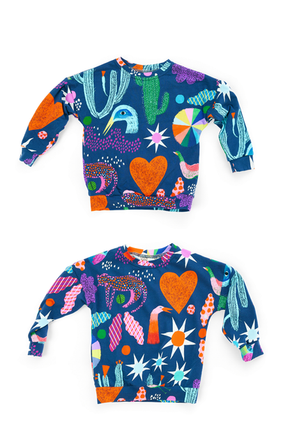 Two colorful children's sweatshirts with abstract patterns on a white background