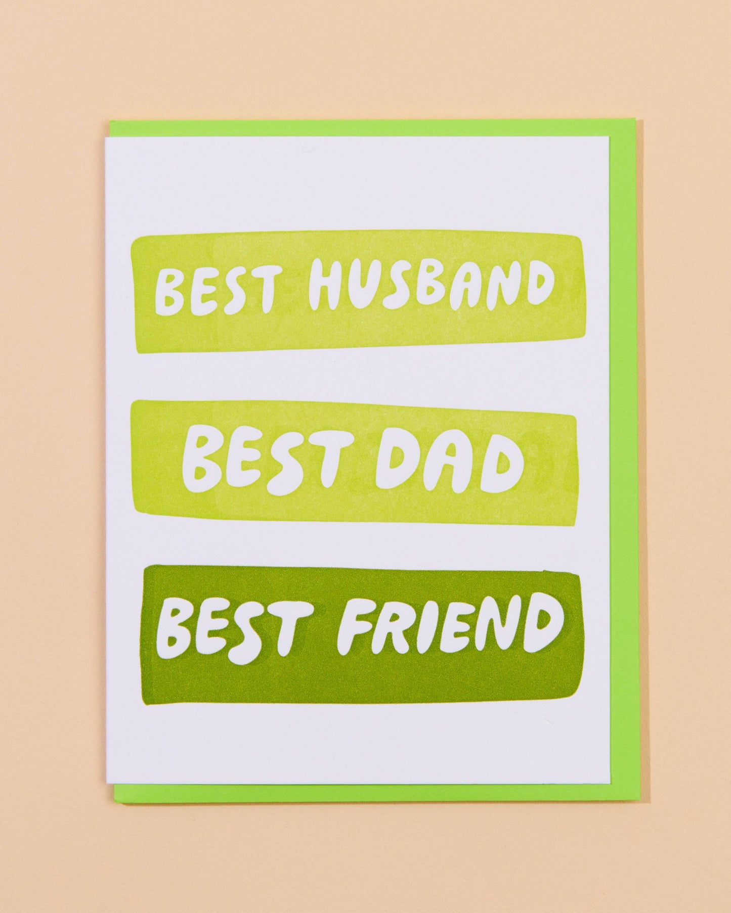 Greeting card with 'Best Husband, Best Dad, Best Friend' text on a beige background