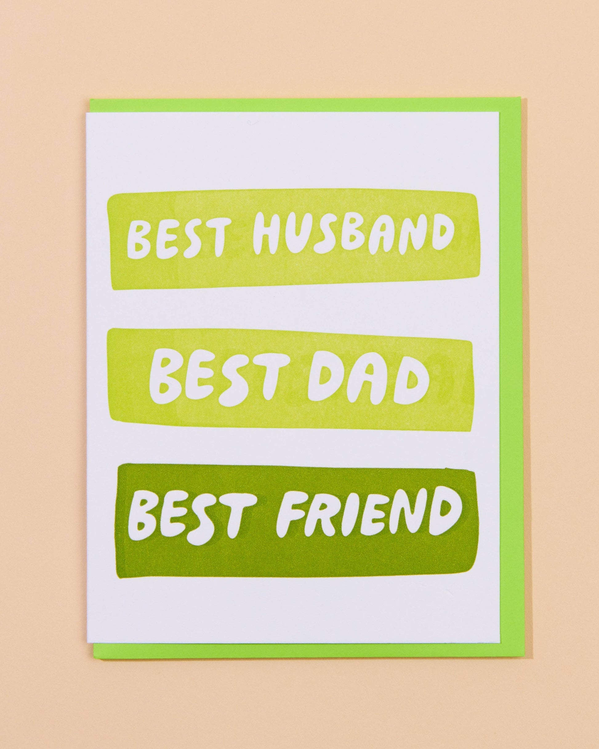 Greeting card with 'Best Husband, Best Dad, Best Friend' text on a beige background