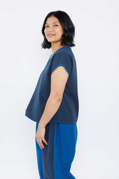 Woman wearing a blue outfit on a white background